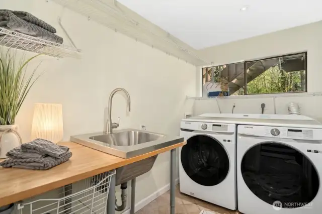 Downstairs laundry room contains a sink - handy for cleaning up quick!