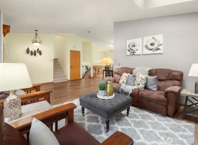 You will be greeted by the living room, dining area and kitchen area.