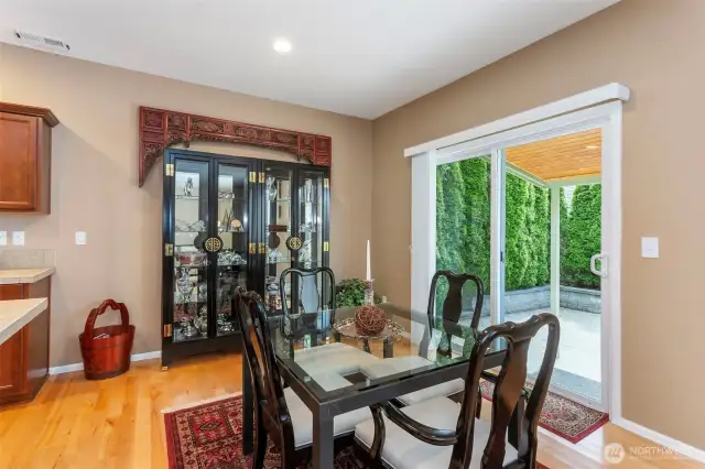 Dining room with door going out to back yard.  Covered entry helps keep wetness at bay