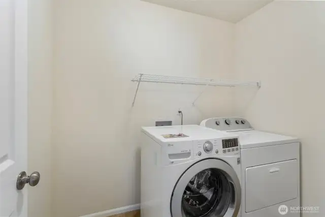 Laundry room directly to left as you come up stairs.  Washer and dryer stay with home.  Plenty of storage space