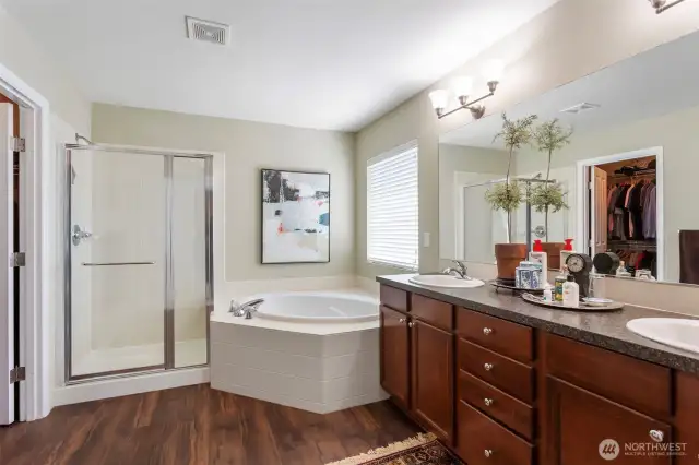 Nice large, clean and bright master bath.  2 sinks for your convenience.  Toilet has been upgraded to high boy
