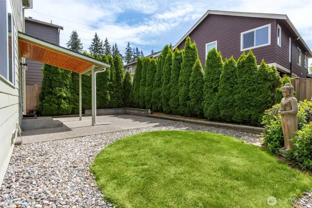 Nice sized yard with attractive landscaping and shrubs