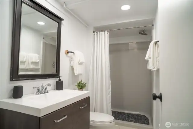 lower level bathroom with tile base & fiberglass shower