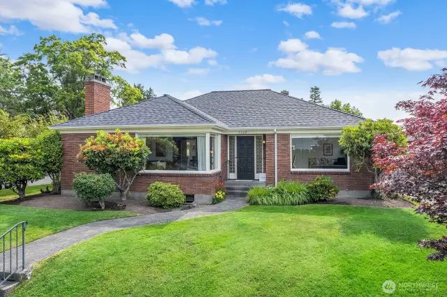 Welcome home to this incredible Mid Century home situated on a corner lot.