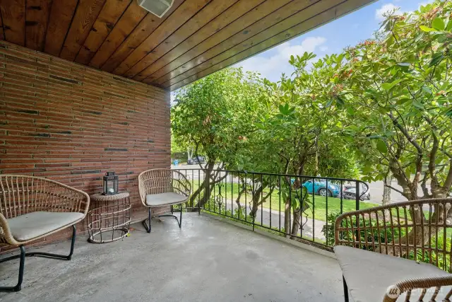 Private covered porch - perfect spot for morning coffee and bird songs, or wind down the day with a cocktail or glass of wine.