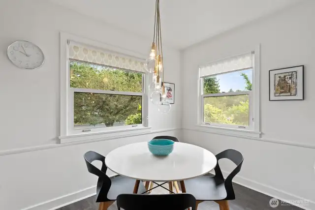 Sweet eat in kitchen dining area that lets in light from two sides.