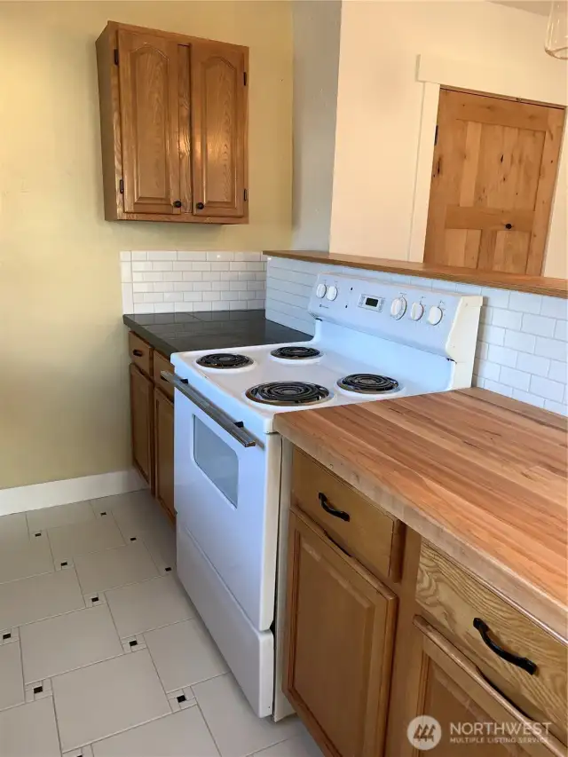 Unit 3 Kitchen and butcher block counter pony wall between living room area