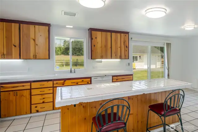 Slider off the dining area goes to the private backyard.