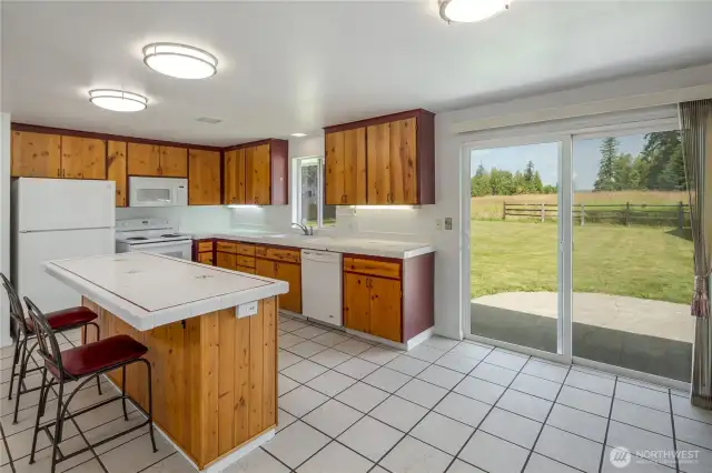 Dining area is right off the kitchen. Door to the garage is to the right.