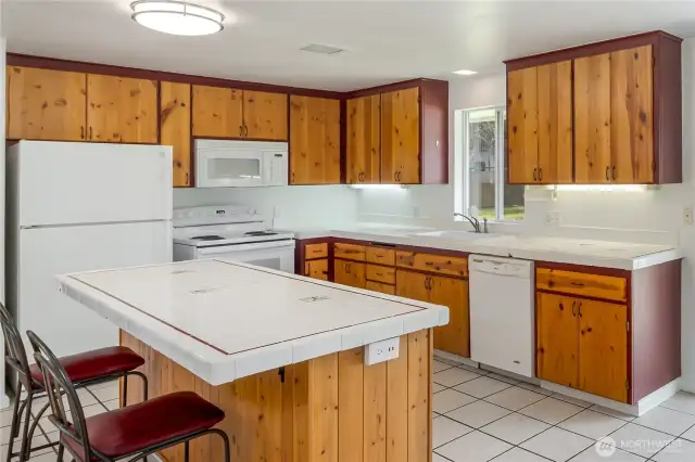 Real wood cabinets, all appliances stay.