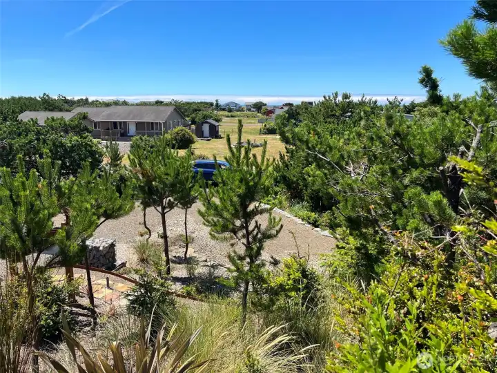 Sightly elevated drone photo looking west from the lot showing the ocean to the west.  Behind the gates of 34010 I street, you will find an RV lot ready to accomodate you with Electrical and water hook ups.