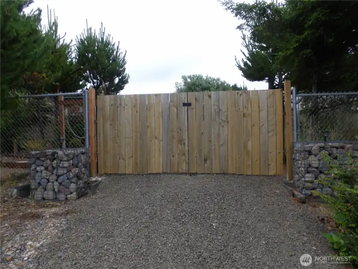You made it!  Open up the gate to your RV lot right near the ocean.