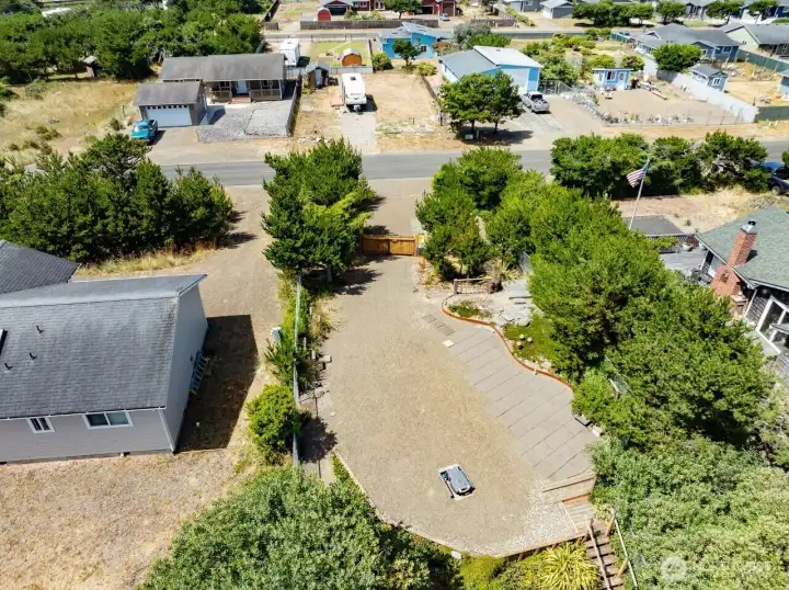 This drone shot shows the top level of the rv lot.  next photo shows stairs leading down to the fire pit area not shown in this drone shot.