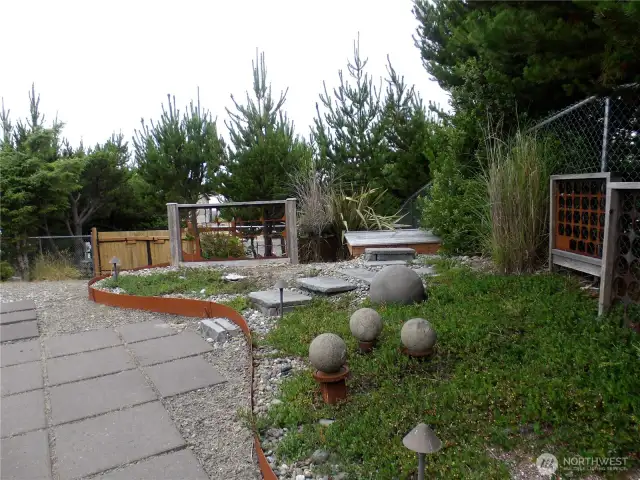 This landscaped area has a small deck that looks west towards the ocean.