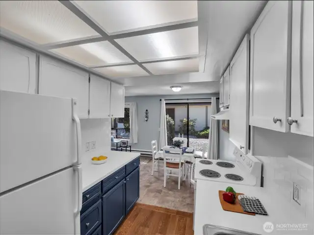 Kitchen updates include new lighting and a repaired tube panel.