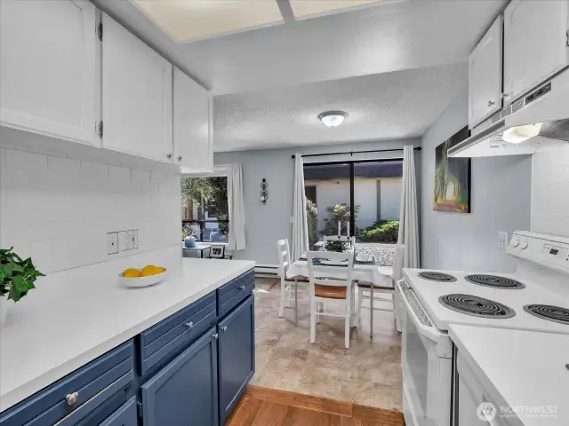 Updated kitchen featuring a brand-new backsplash and refreshed countertops.