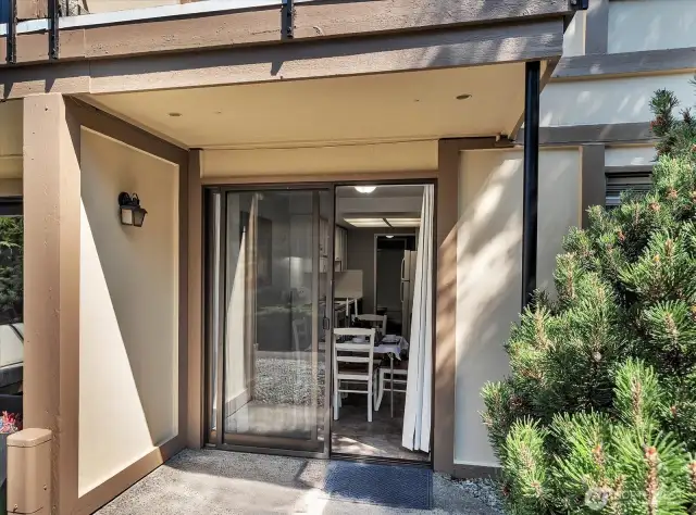 Dining room opens to a peaceful patio, ideal for relaxing or dining alfresco.