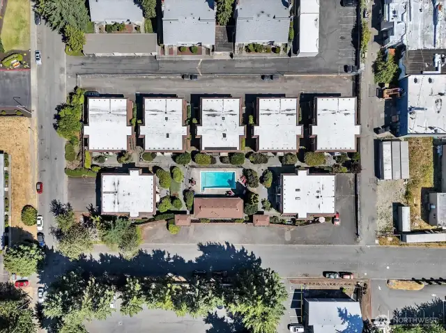Here’s an aerial view showing the spacious layout and community features. Among the seven buildings, your new home is nestled in the upper left-hand corner, ready to welcome you.