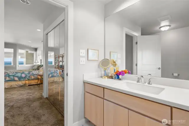 Ensuite bath for the first bedroom- light wood cabinets keep it bright