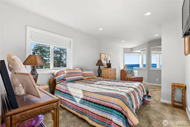 Another spacious bedroom upstairs and it doesn't disappoint with it's water views either.