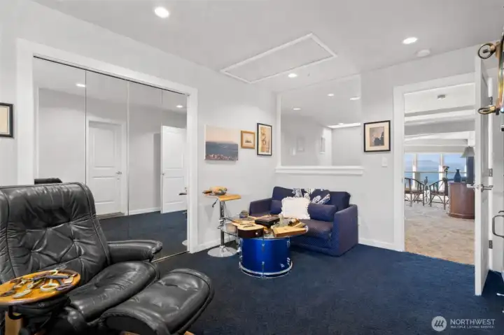 Even the office has a window that brings in water view.  Sized right for office needs and then some.  Attic access above.  More closet space behind the mirrors