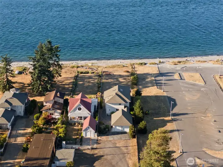 Backside of the home as you enter.  Nice buffer of trees between you and the overflow parking for the lighthouse
