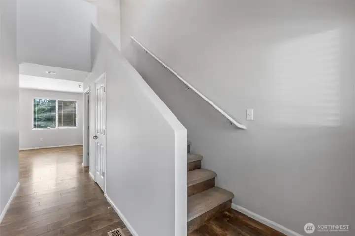 Come on in! All of the flooring has been replaced to be easy-care LVP. The stairs are thoughtfully carpeted on the treads for safety.  All new interior paint was just completed