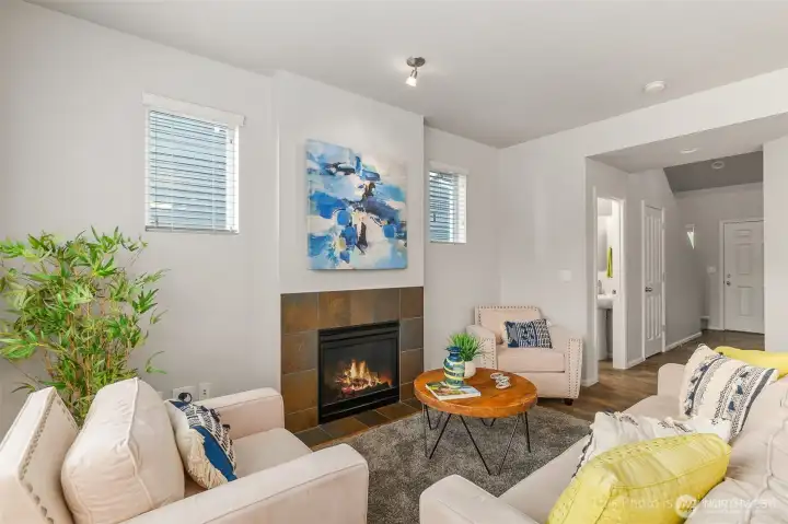 Handsome gas fireplace with tile surround is a cozy spot for upcoming fall and winter days and nights