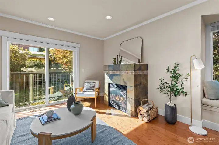 Bright and airy living space with a gas fireplace and southern exposure