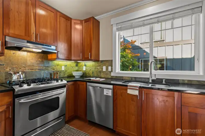 Chefs will love the gas range and slate backsplash