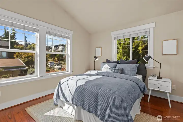 South-facing bedroom with vaulted ceilings and en suite bathroom