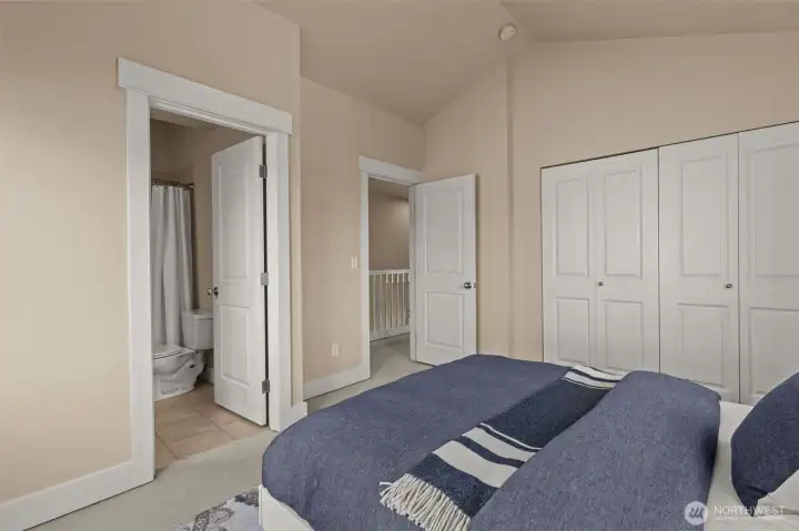 Second bedroom with vaulted ceilings and en suite bathroom