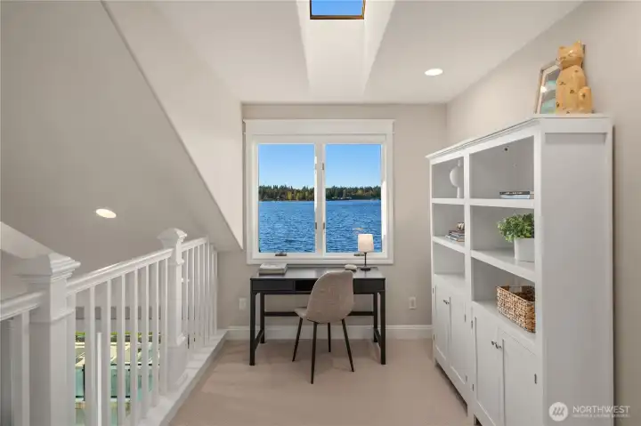 The bright sunny loft is the ideal place to read a book while peering out to the lake.