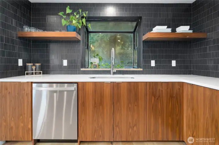 Detail of garden window and floating shelves in kitchen.