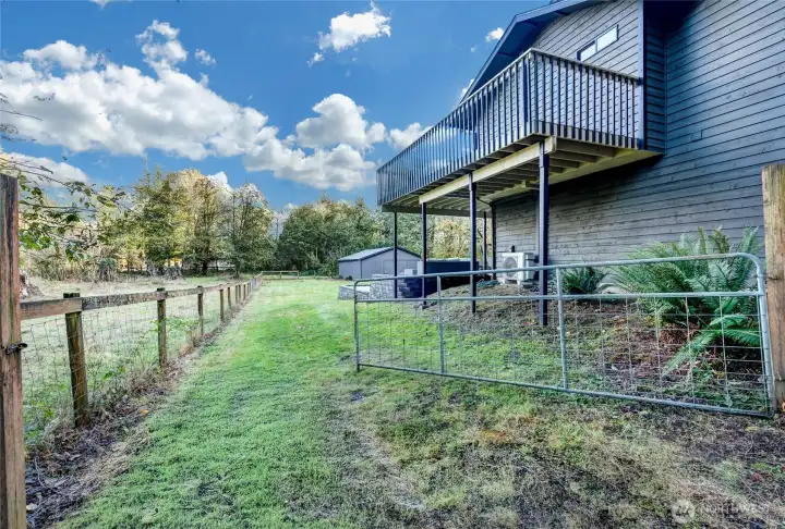 Fully fenced with wide side-gates on both sides of home.
