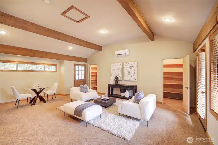 Great room living, with wall to wall storage space.