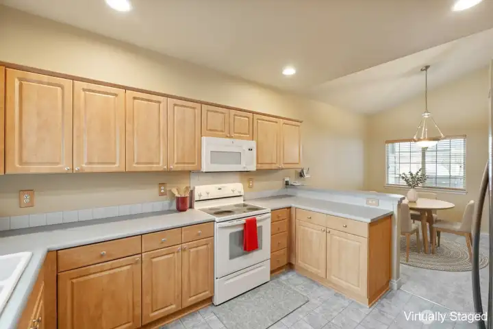 Virtually staged. Look at all of the counter space. Bar area, too.