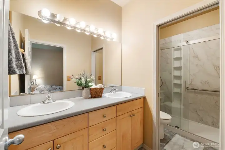 Primary Bath, pocket door for toilet/shower area.