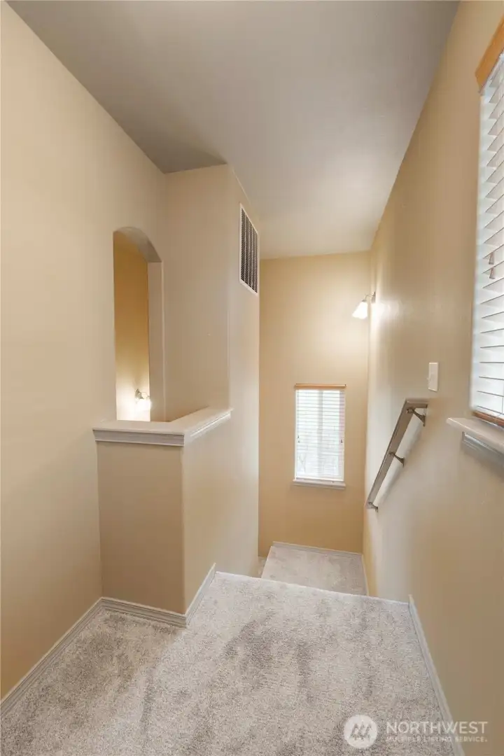 View from the top of the stairs. More windows for natural light.