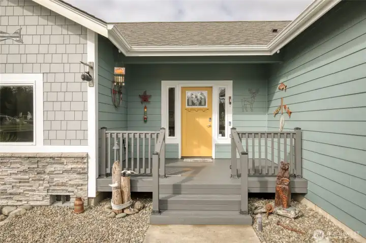 front entrance with a deck