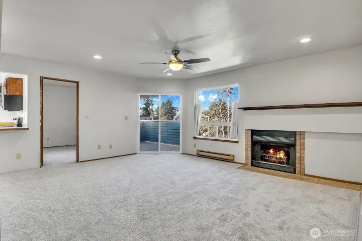 As you enter the home, you are greeted by a light and bright open living and dining area with new carpet.