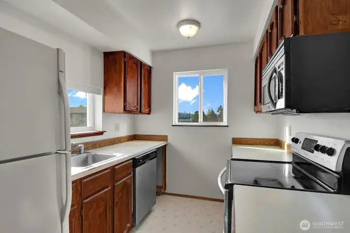 This galley style kitchen has a practical layout with plenty of potential for your personal touches.