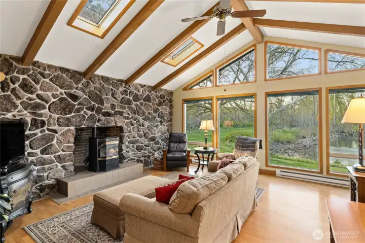Cozy pellet stove with stone surround and skylights.