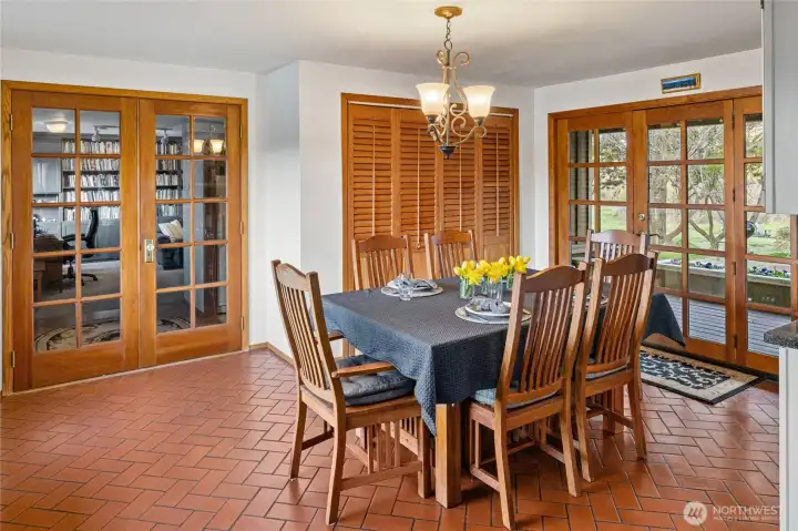 Dining area with so much natural light overlooking the pond
