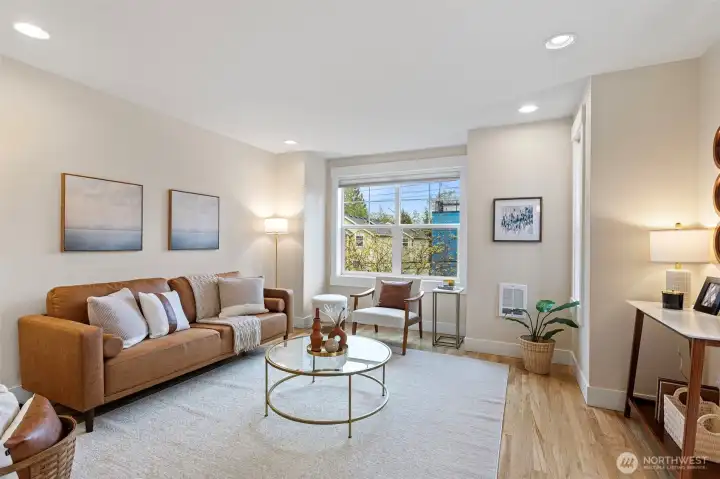 The main level welcomes you with a wide, open layout enhanced by large windows and charming nooks.