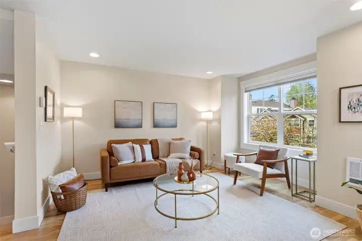 The Living Room is spacious, light-filled and looks east toward the entrance to Licton Springs park.