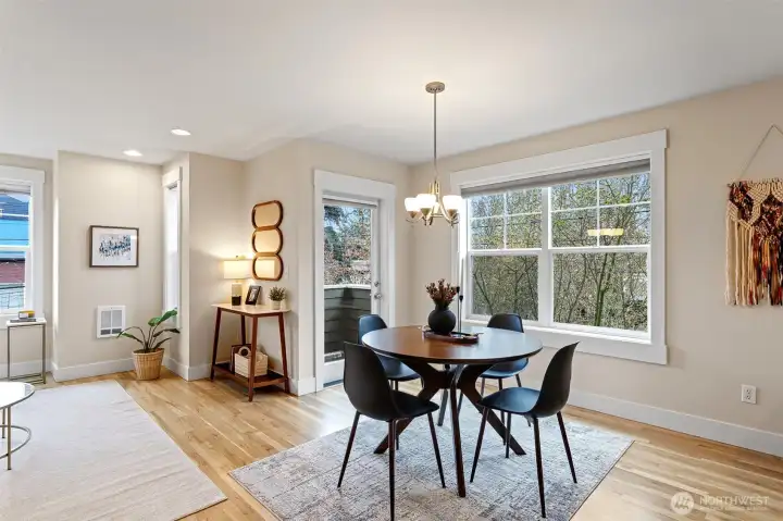 A great floor plan with a wide living area main floor space, enveloped by outside greenery and a sweet little balcony overlooking the backyard!