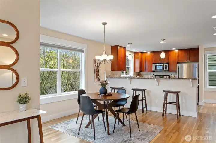 A nice big space for the dining room table with a nice flow through to the kitchen and living room on the other side. Big windows and lots of them! Newly refinished hardwood floor.