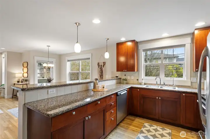 The larger than usual kitchen offer plenty of seating at the breakfast bar. Enjoy your morning coffee or set up your laptop at the raised counter for a days work!