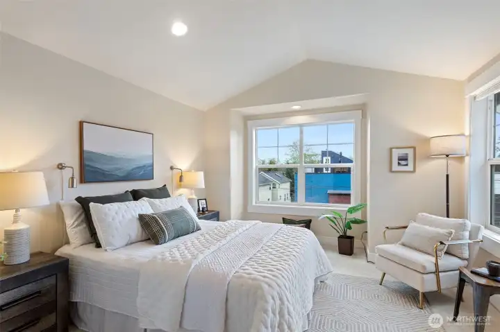 Large primary suite with vaulted ceilings and Mt Rainier & park-facing views, creating a true retreat.